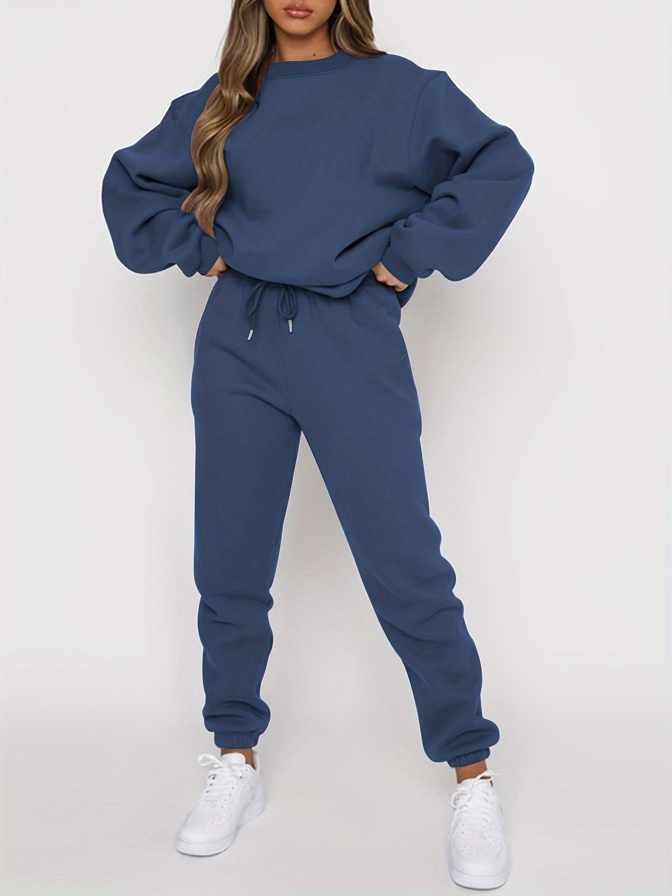 Women's gray oversized sweatshirt and high-waisted jogger set with relaxed casual fit