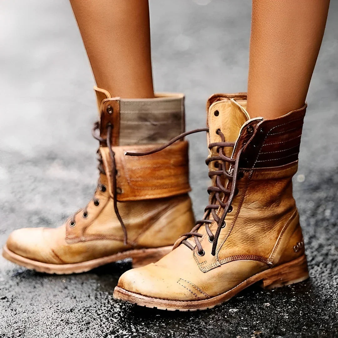 Women's black lace-up combat boots with cushioned insole and durable metal eyelets for all-day wear