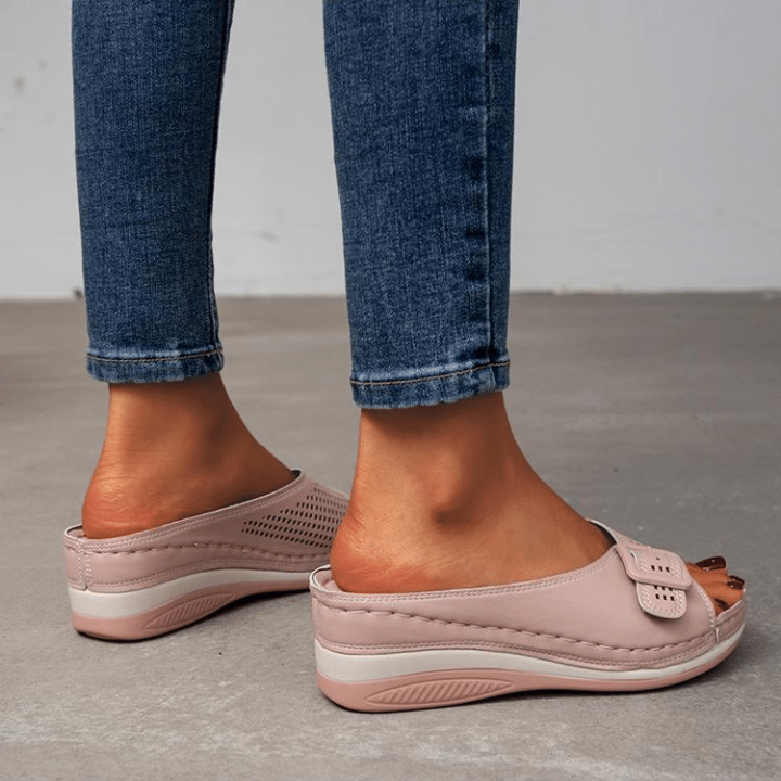 Women's comfort flat sandals in neutral tones with soft footbed cushioning and elegant supportive silhouette