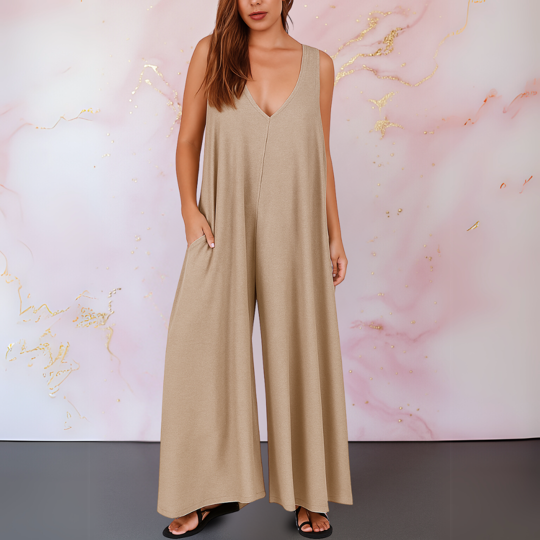 Black sleeveless wide-leg jumpsuit with deep V-neckline, flowing silhouette, and side pockets