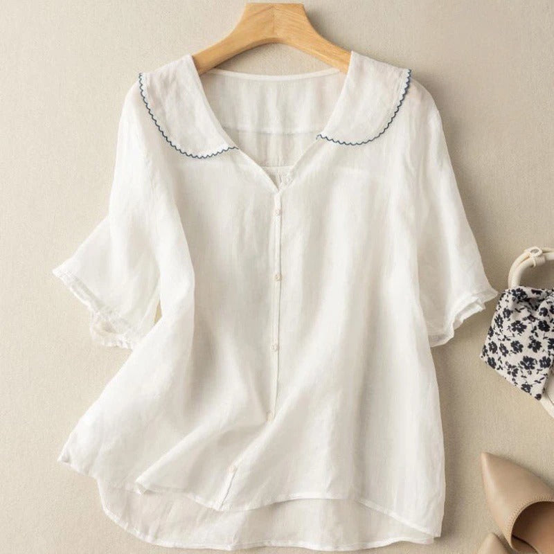 Vintage women's blouse in soft tones with scalloped collar and delicate button front detail