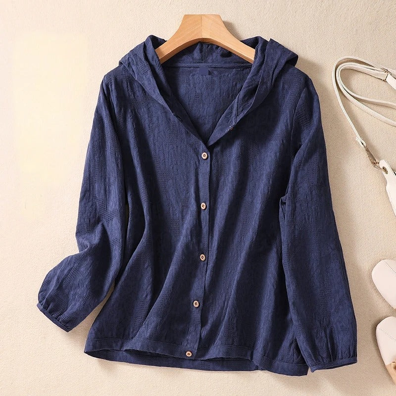 Relaxed hooded shirt in soft neutral tones with clean lines and breezy warm-weather drape