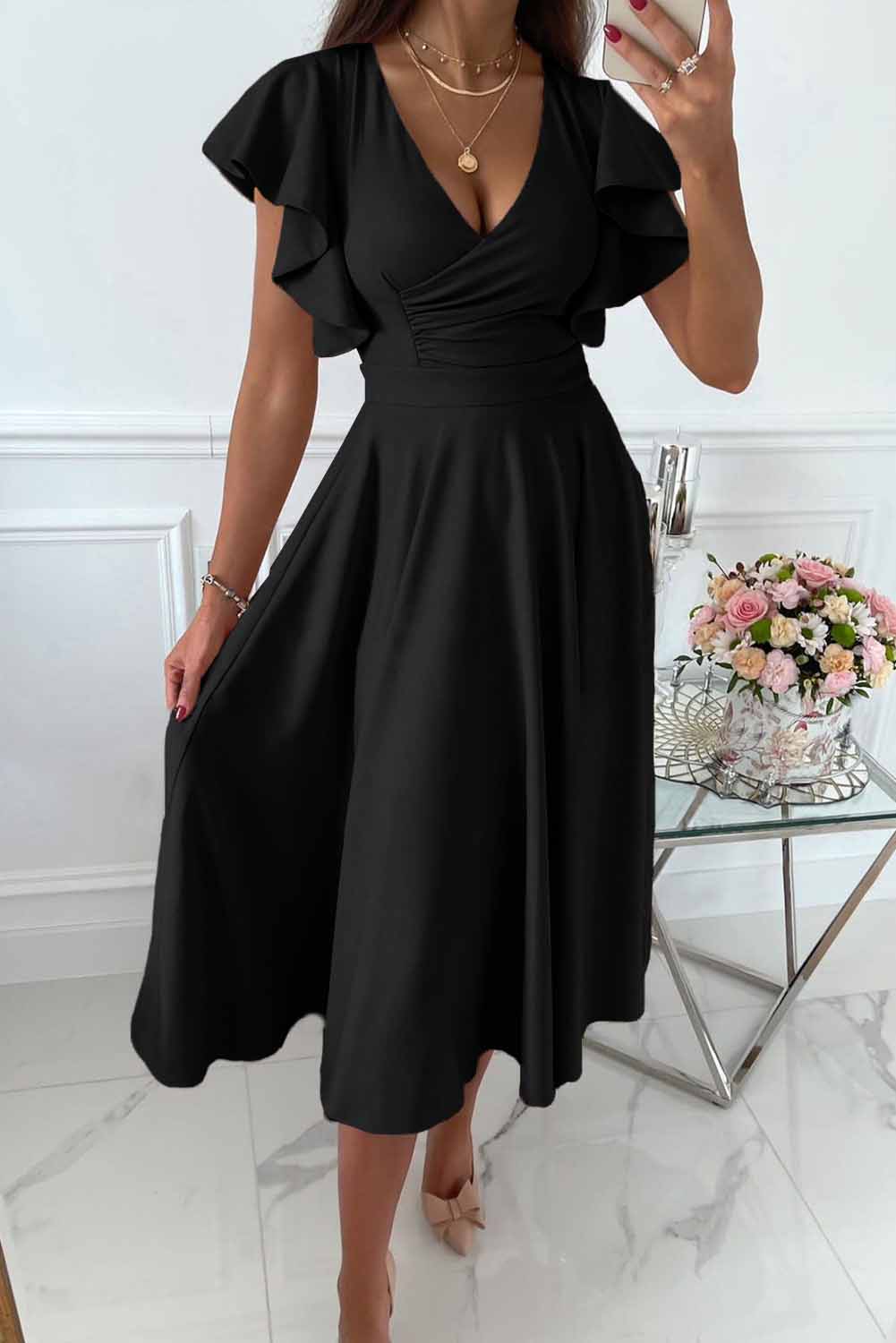 Women's wrap dress with V-neck and ruffle sleeves, elegant feminine silhouette for versatile occasions