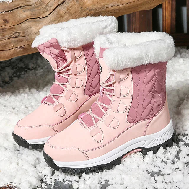 Women's mid-height quilted snow boots with faux fur trim and lace-up closure, water resistant