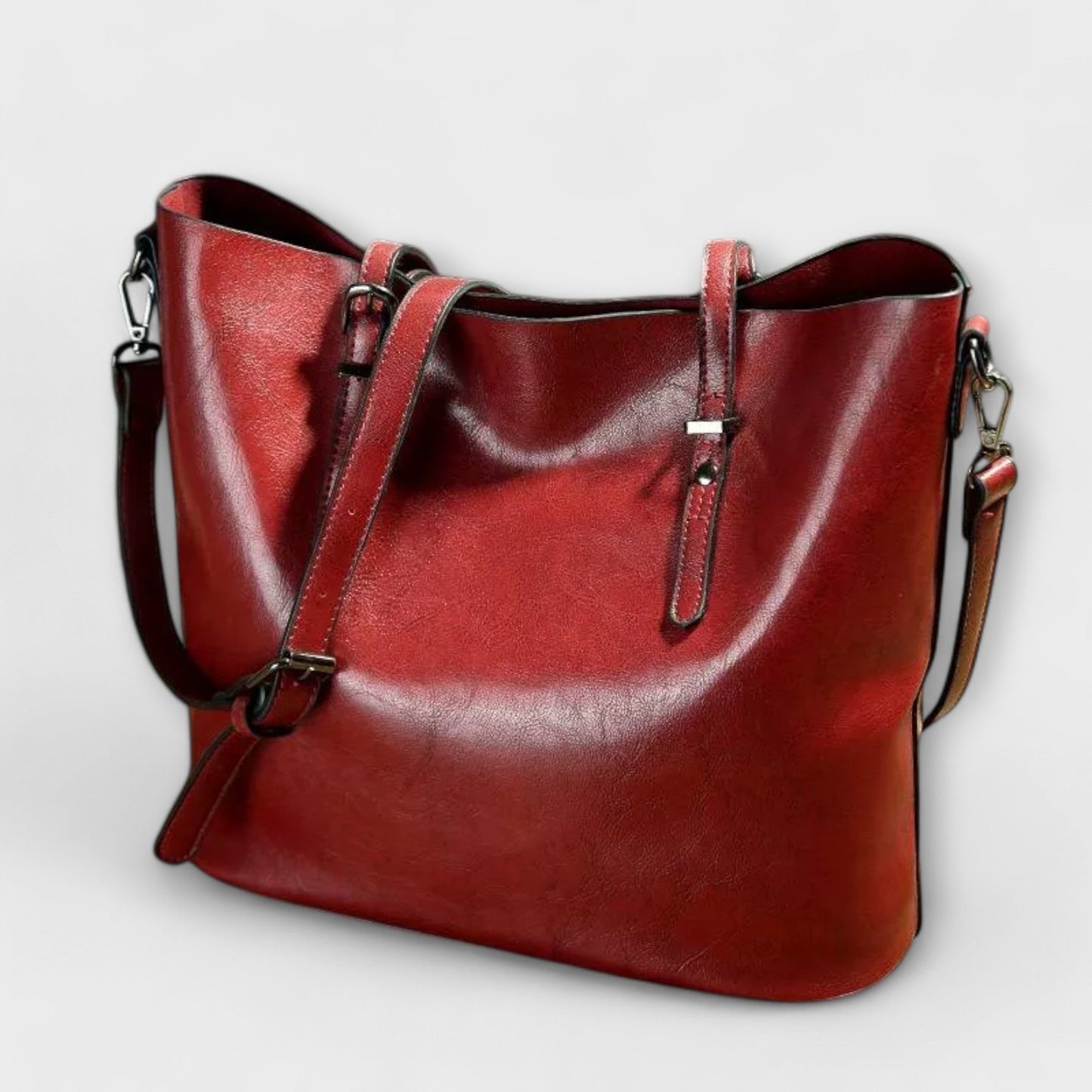 Alruna™ black shoulder bag with clean design, adjustable straps, and spacious functionality