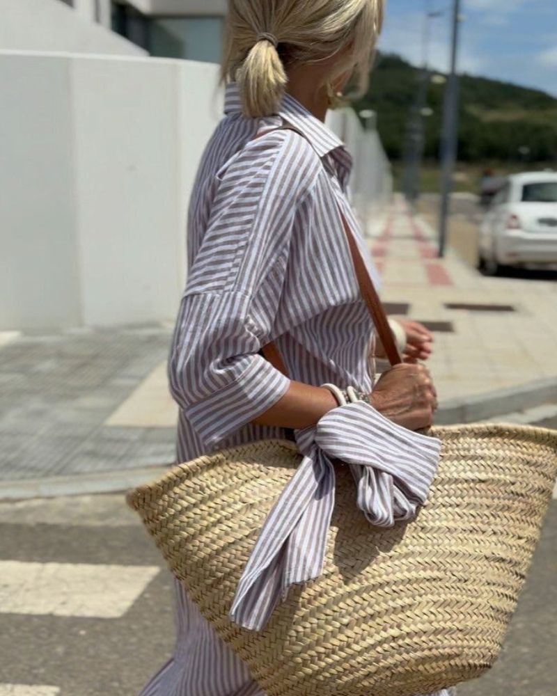 White and black striped shirt dress with flattering silhouette and classic button-front design