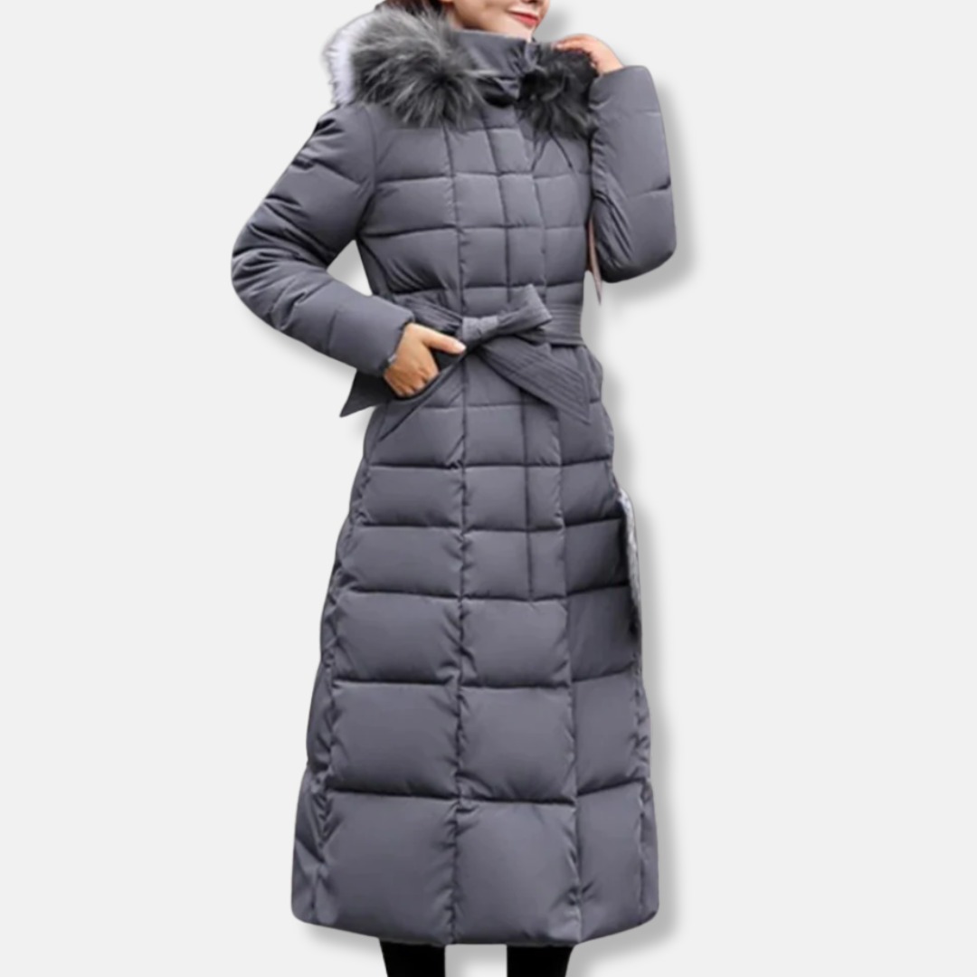 Women's long slim-fit quilted coat with belted waist, fur-trimmed hood, insulated winter style