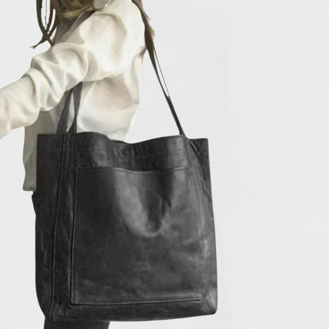 Minimalist black robust tote bag with spacious silhouette and clean everyday design