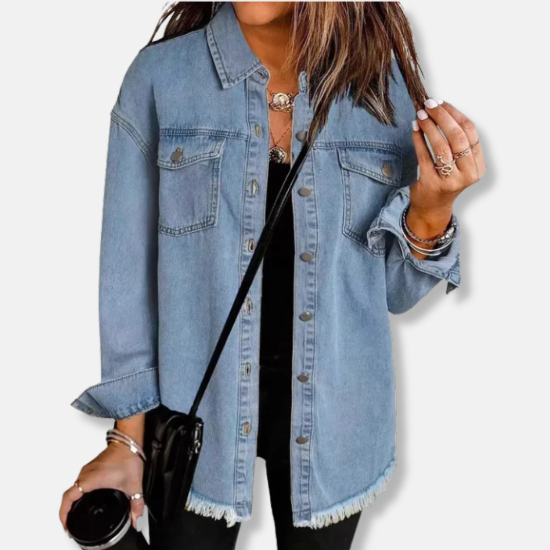 Women's oversized denim shacket in blue with button front closure and raw edge hem detail