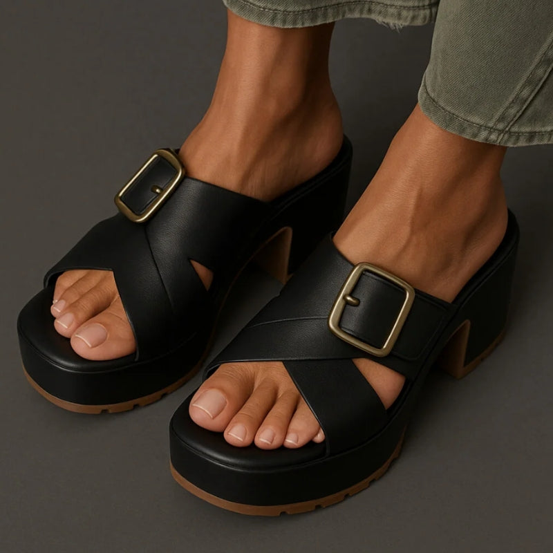 Beige orthopedic platform sandals with crisscross straps and bold adjustable metal buckle closure