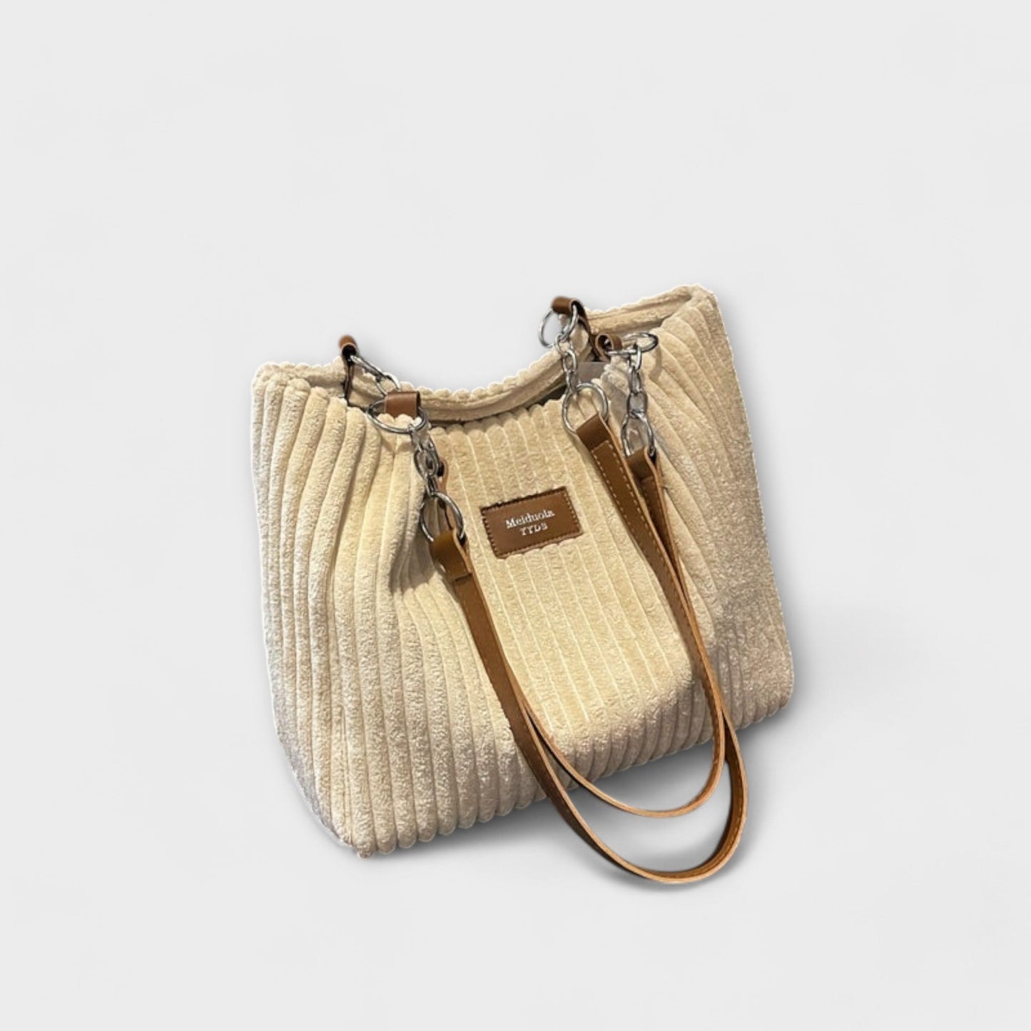 Ribbed shoulder bag with metal chain strap, urban chic style in neutral tone, compact everyday design