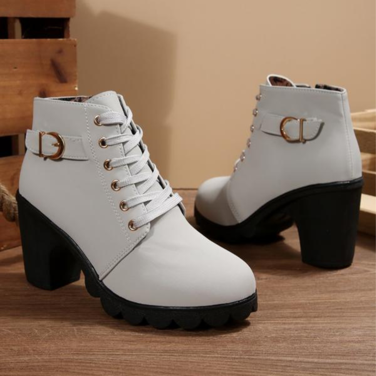 Black chunky ankle boots with lace-up design, bold thick sole, and sleek flattering ankle silhouette