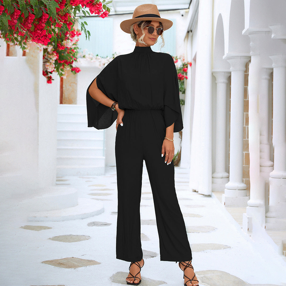 Women's black wide-leg jumpsuit high neck slit cape sleeves fitted waist Nordic style