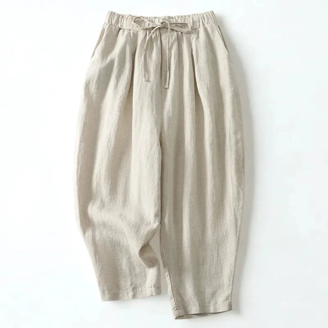 Beige wide-leg linen pants with elastic drawstring waist, relaxed silhouette for effortless everyday style