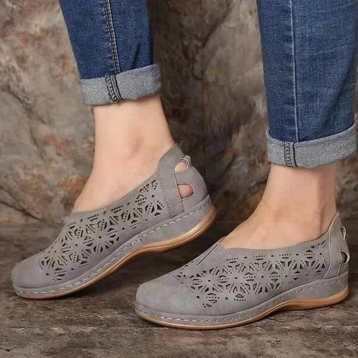 Women's beige slip-on shoes with chic cut-out perforations, effortless elegance for casual to semi-formal wear
