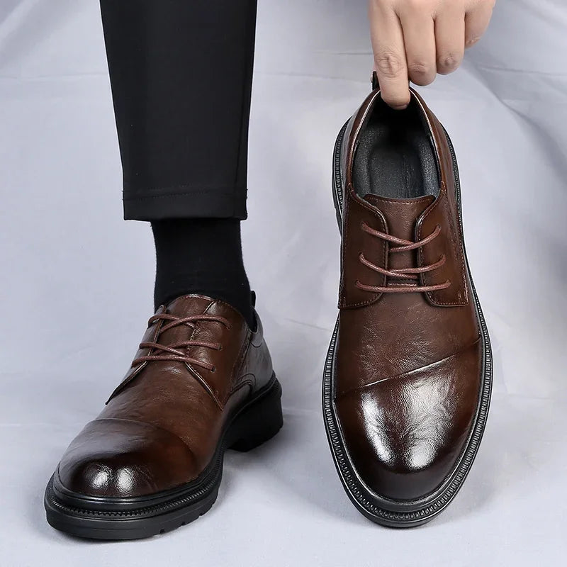 Edwin genuine leather Oxford shoe in rich high-shine finish with cap-toe detail and chunky treaded sole