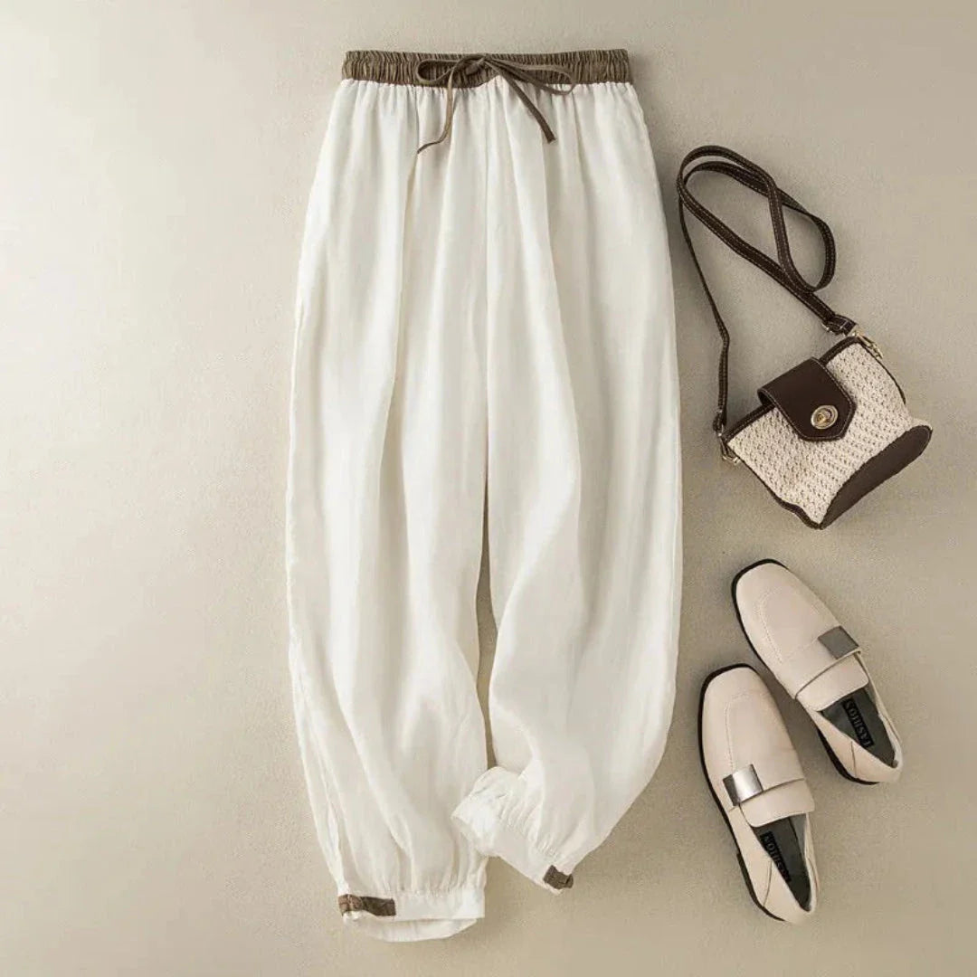 Women's beige relaxed-fit linen trousers with drawstring waistband and adjustable cuffed ankles