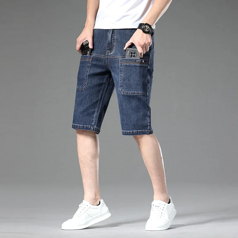 Blue relaxed straight denim shorts with oversized cargo pockets, above-knee utility cut