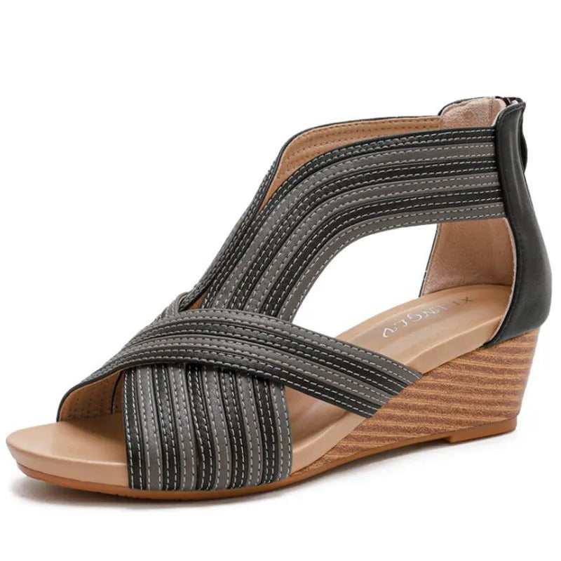 Beige and gray strappy wedge sandals with sculptural woven upper and cushioned platform footbed