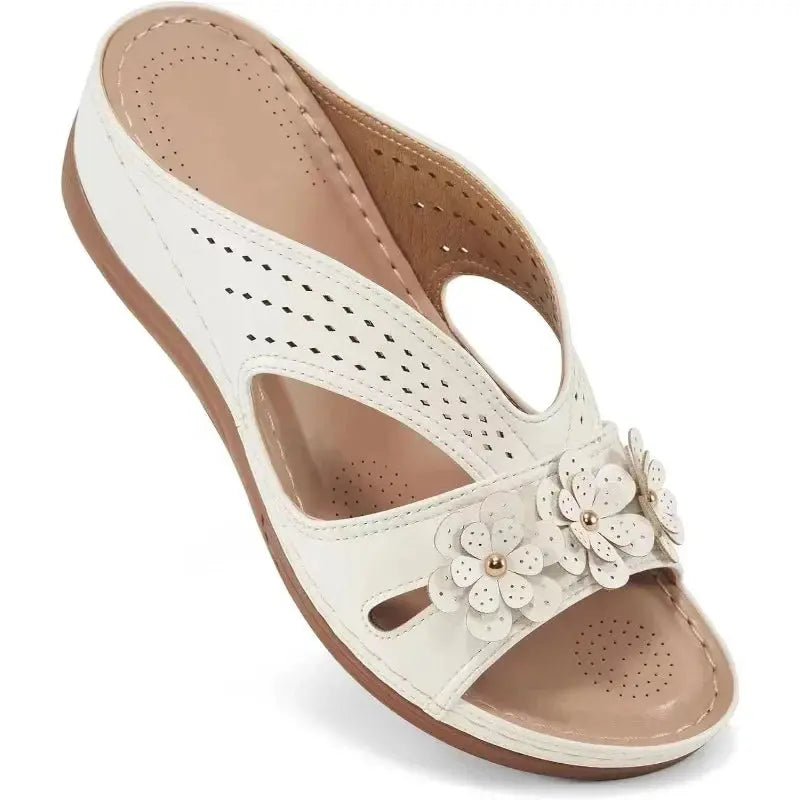White hollow wedge sandals for women with decorative flower embellishment, stylish & comfortable
