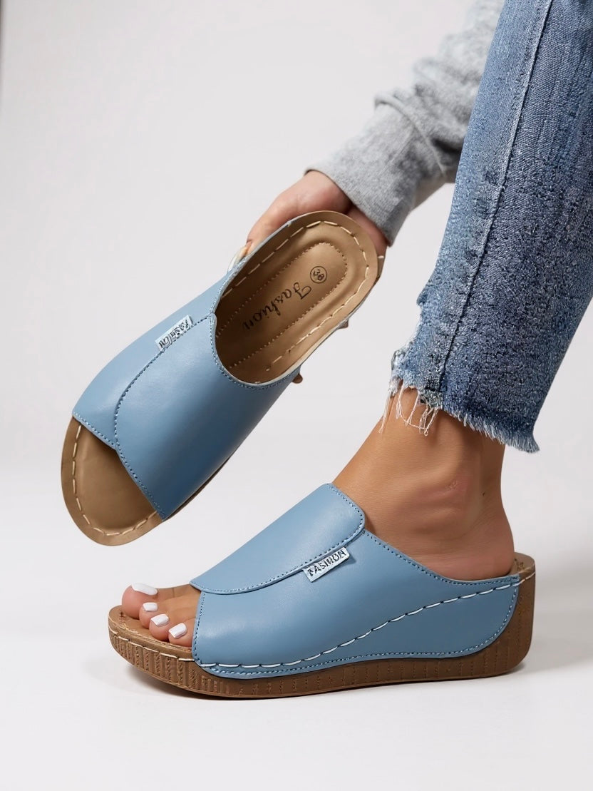 Women's minimalist platform cushioned slides in heather tone with contoured footbed and sleek sole