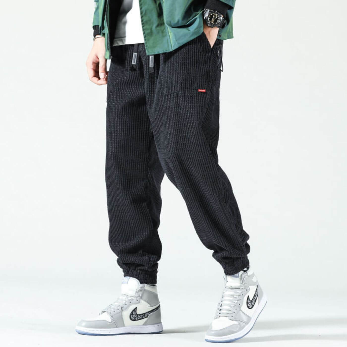 Classic corduroy joggers in warm neutral tones with flexible fit and refined ribbed texture