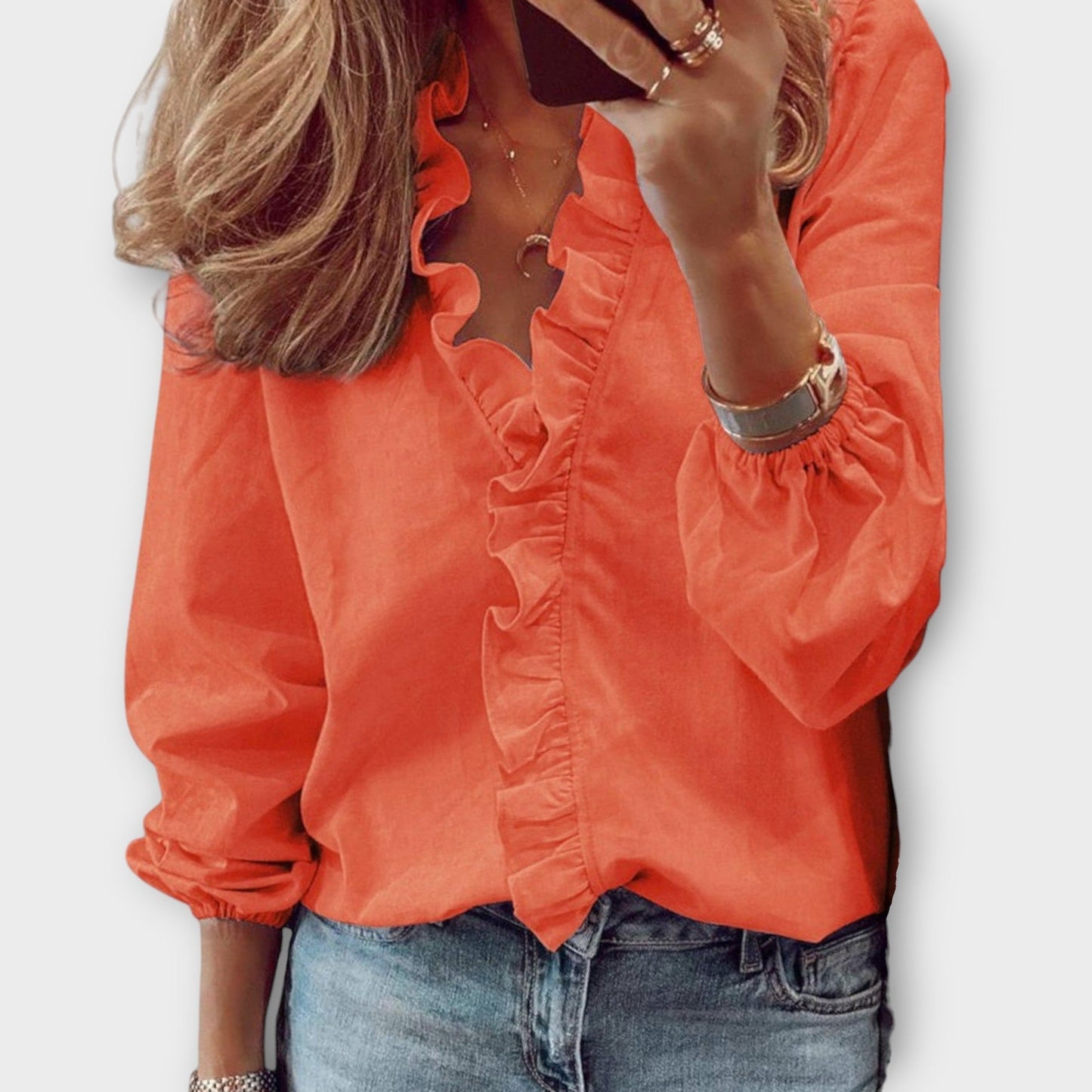 Women's ivory ruffle front V-neck long sleeve blouse with cascading ruffle trim detail