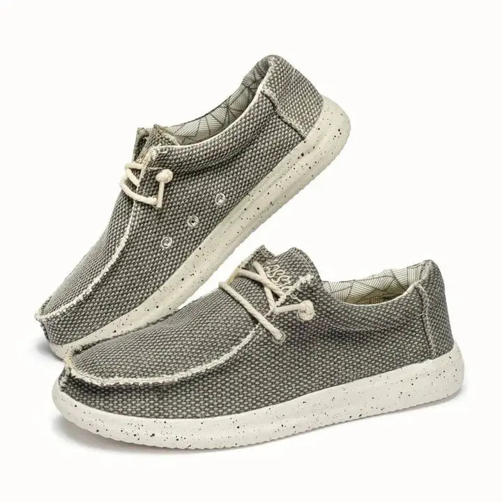 Women's lightweight slip-on shoes in neutral tones, cushioned daily wear style with easy on/off design