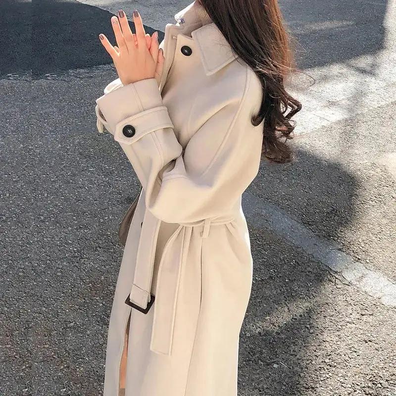 Women's long belted trench coat classic silhouette versatile full-length outerwear workday to evening