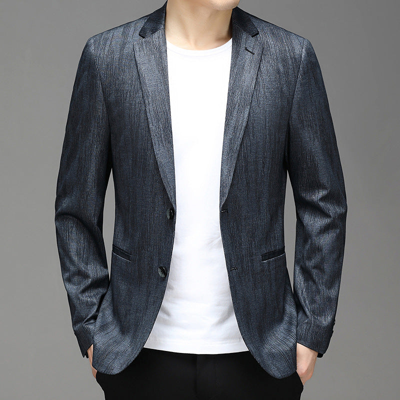 Textured deep-blue slim-cut blazer with silky structured fabric and modern sheen finish