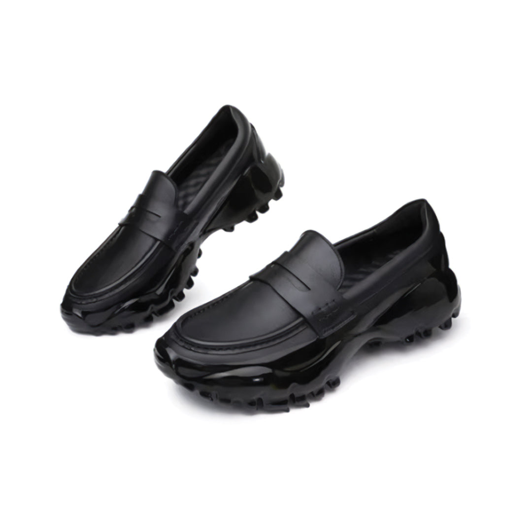 Magma Black leather loafer minimalist silhouette with bold thick enamel-coated outsole