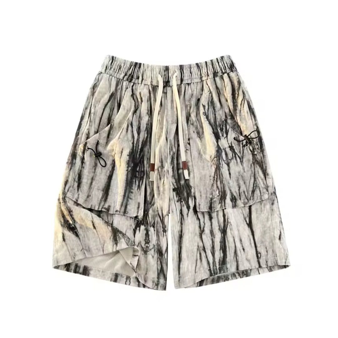 Marble tie-dye corduroy shorts with elastic drawstring waist and bold patchwork pattern