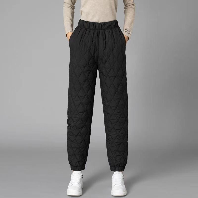 Black diamond-quilted jogger pants with elastic waistband and cuffs, street style comfort fit
