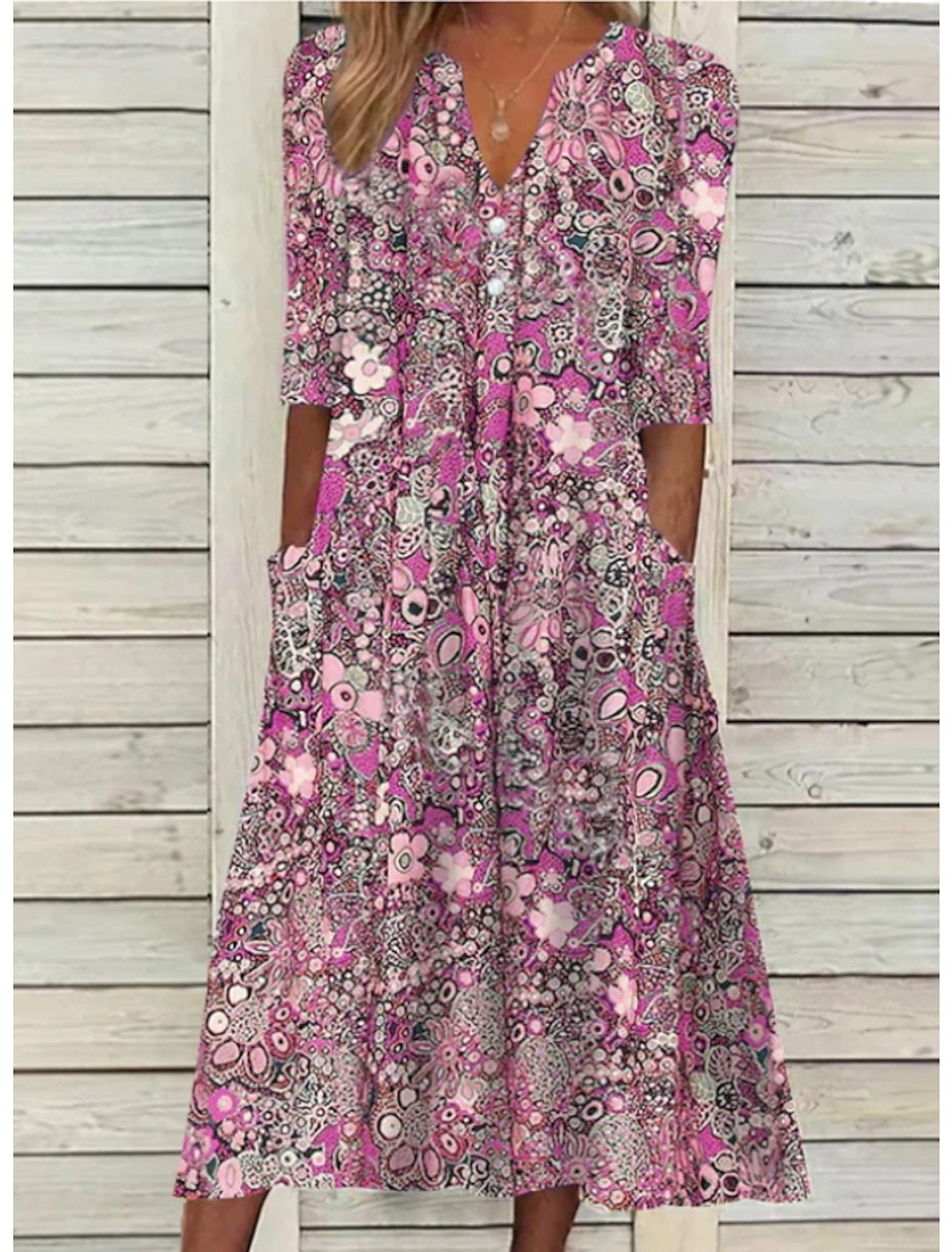 Elegant floral summer dress with tummy-covering drape, flattering silhouette for women