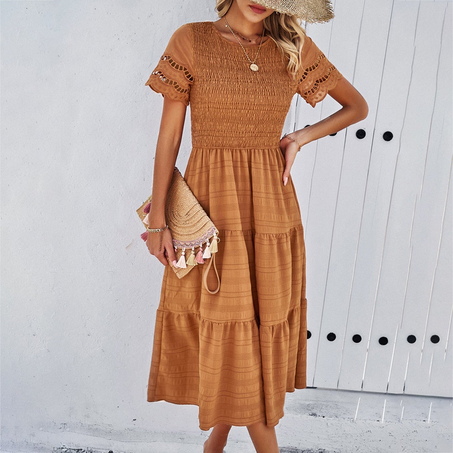 Women's loose fit midi dress with smocked bodice, tiered skirt, and cut-out short sleeves in cotton