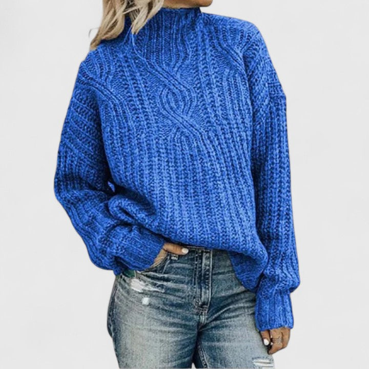 Sophisticated ribbed sweater in neutral tones with tailored drape and polished slim-fit silhouette