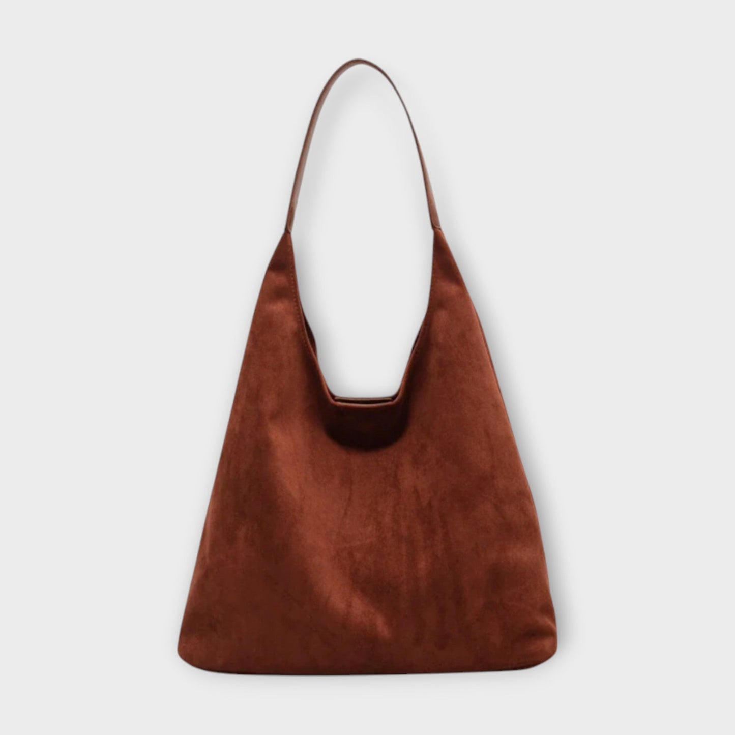 Minimalist beige shoulder bag with soft silhouette and simple strap for effortless everyday style