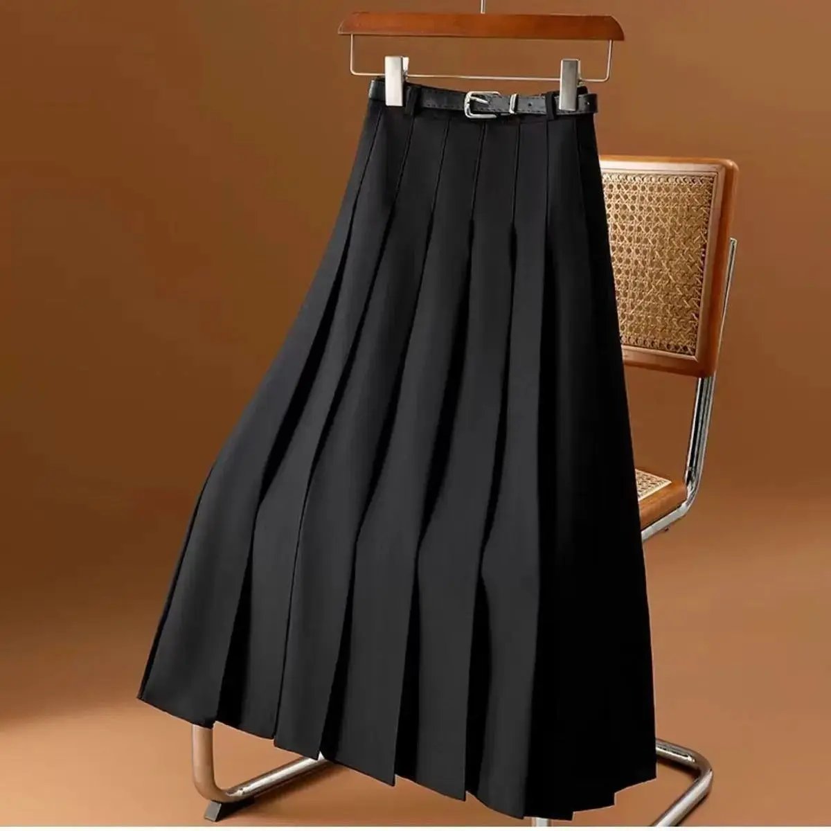 Black pleated midi skirt for women with knife pleats, elegant silhouette, versatile smart-casual style