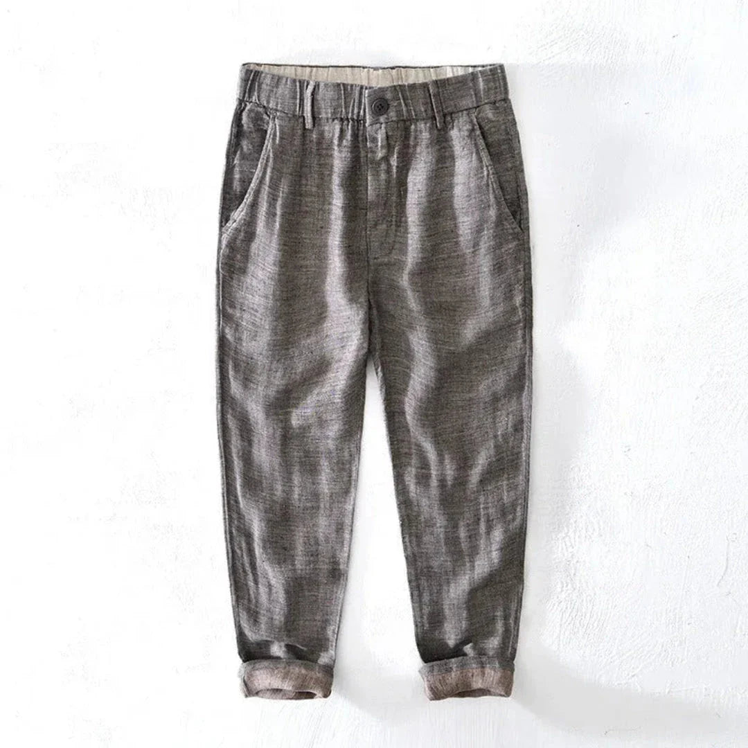 Kids' beige linen tapered trousers with elastic waistband, lightweight casual fit for active children