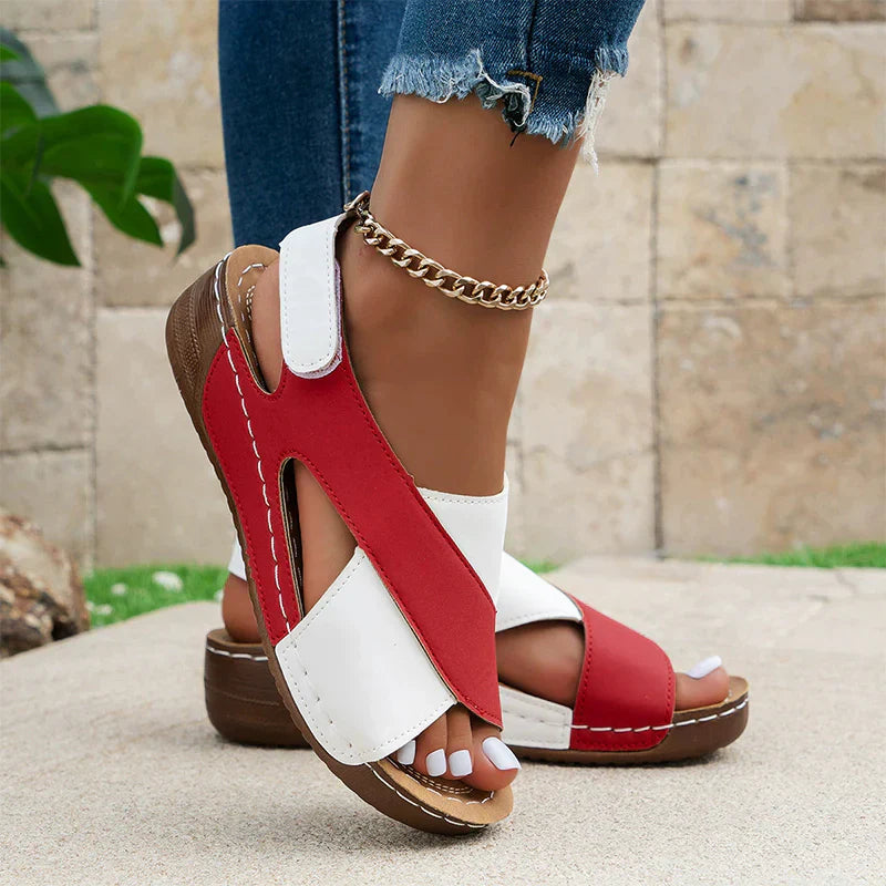Women's beige open-toe comfort sandals with adjustable slingback strap and contoured cushioned footbed
