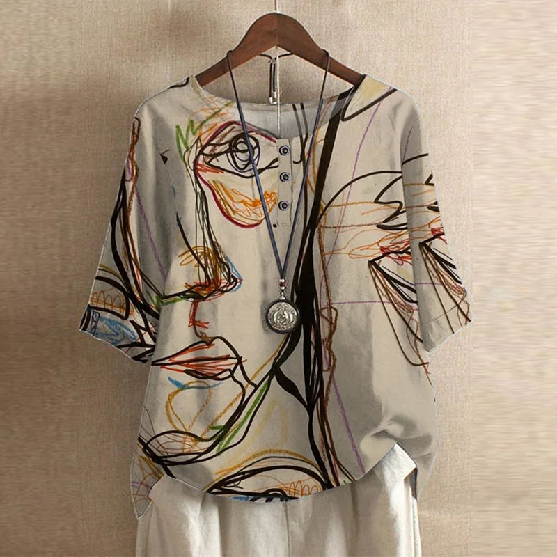 Vintage floral blouse relaxed fit retro-inspired design in soft muted tones for effortless everyday elegance