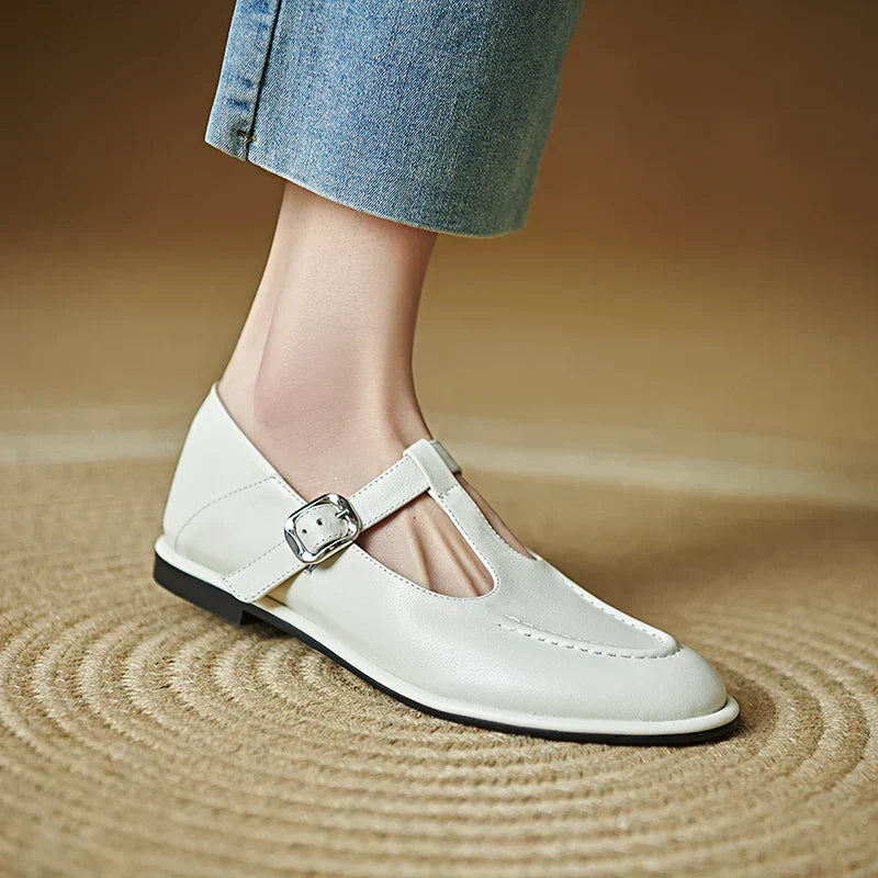Women's vintage T-strap Mary Jane flats with round toe, low block heel, and buckle closure