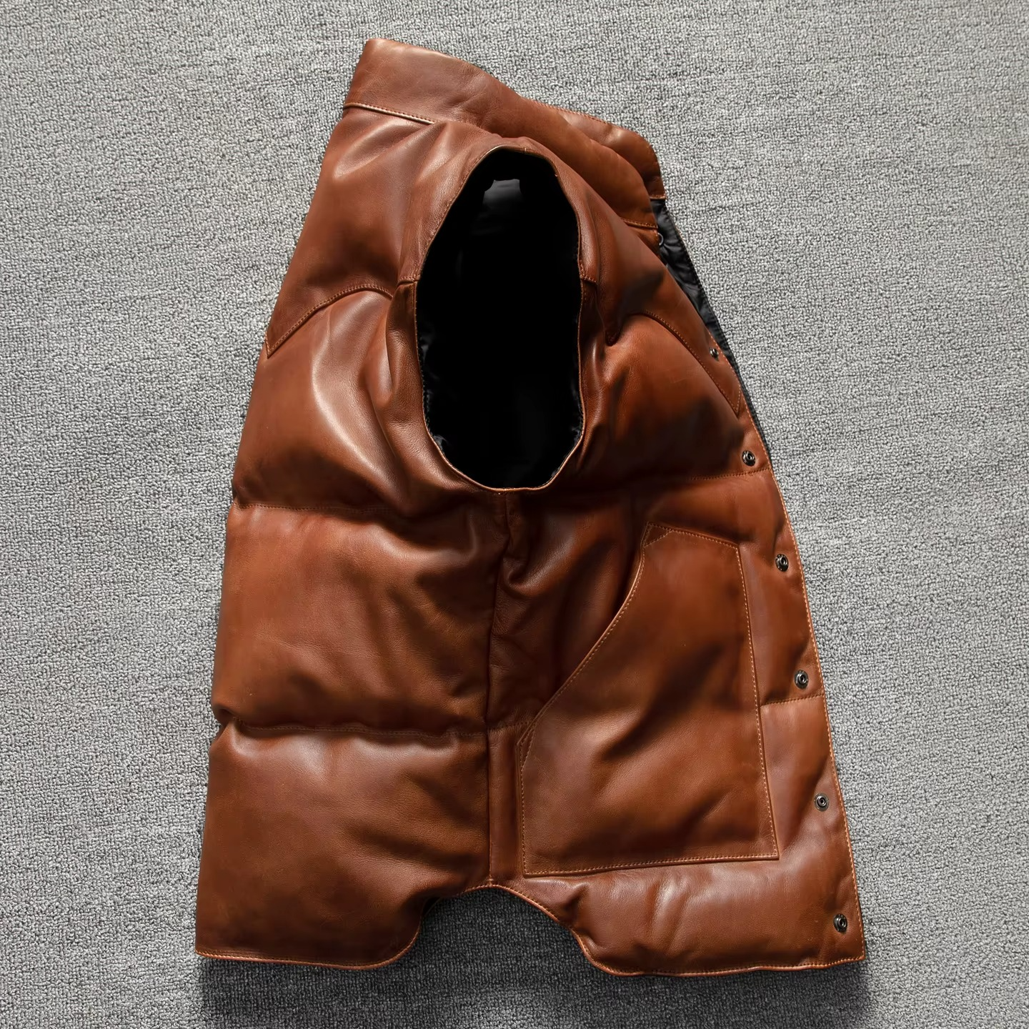 Men's dark brown quilted lambskin leather biker vest with insulated puffer design