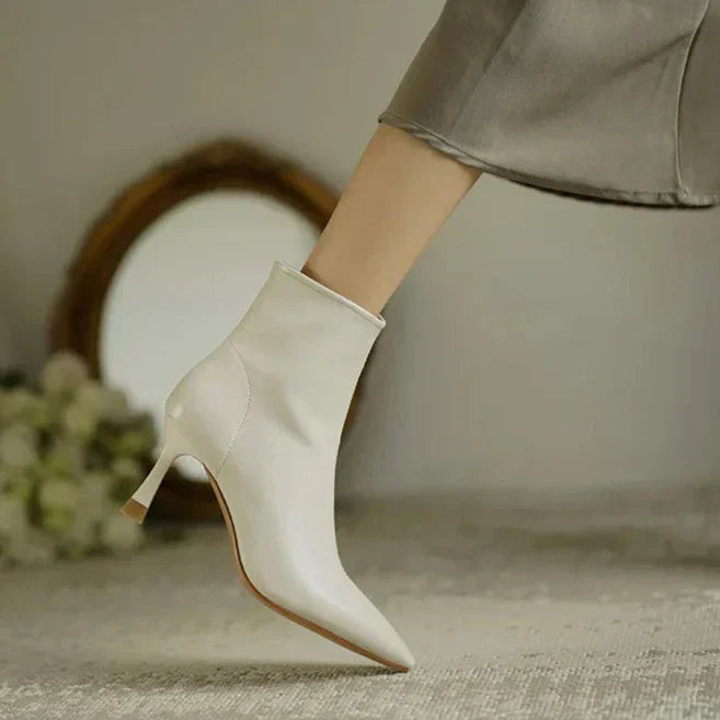 Sleek black ankle boots with slimming sculpted profile for confident everyday wear