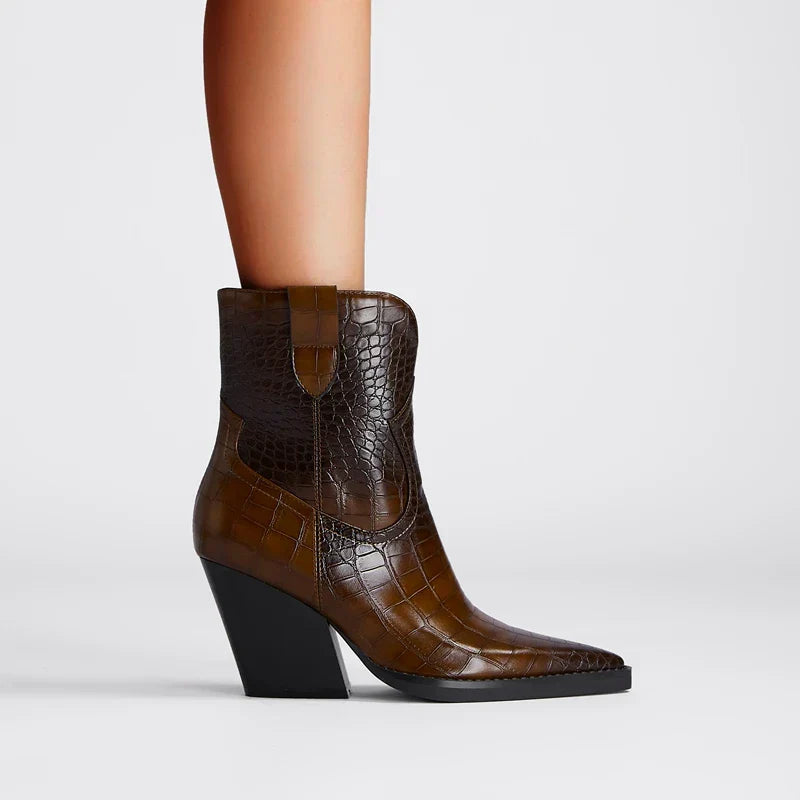 Brown leather western-inspired ankle boots with subtle detailing and leg-lengthening silhouette