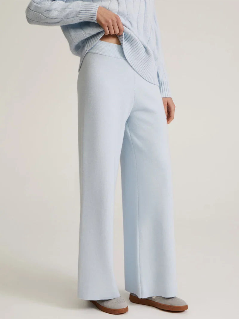 Ivory cable-knit cashmere turtleneck set with relaxed fit and textured knit details
