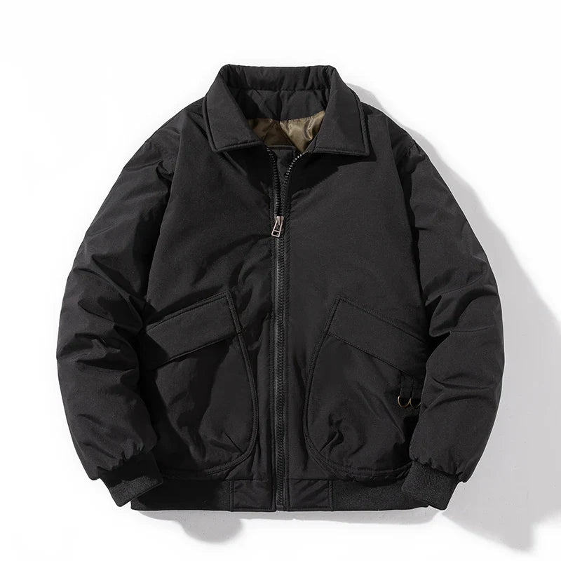 Black quilted bomber jacket with bulky streetwear fit, cargo pockets, ribbed cuffs, and windbreaker exterior