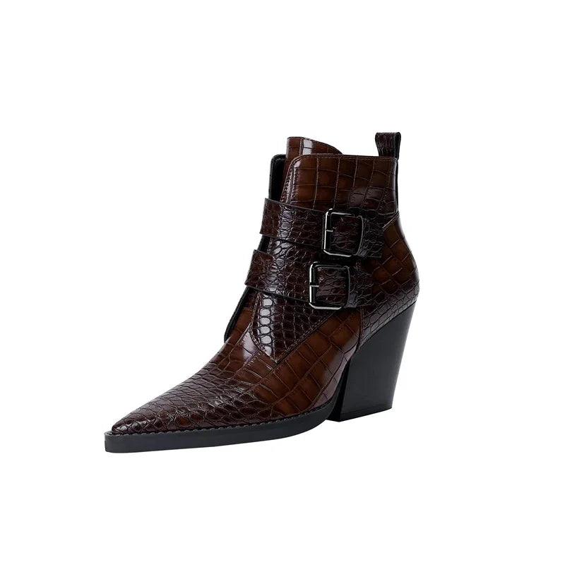 Black sleek buckle boots with bold statement buckle details and leg-lengthening silhouette