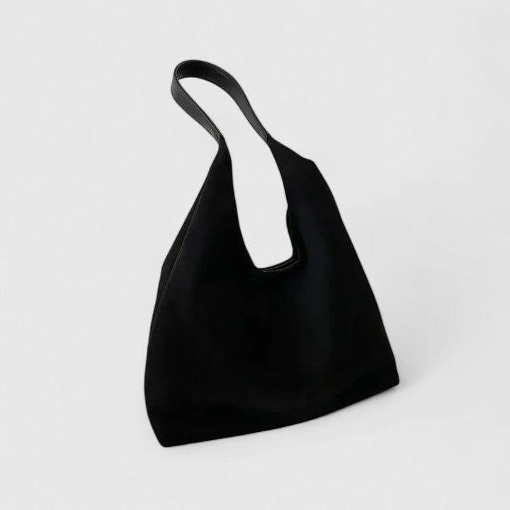 Minimalist black shoulder bag with clean lines, structured silhouette, and sleek top-handle design