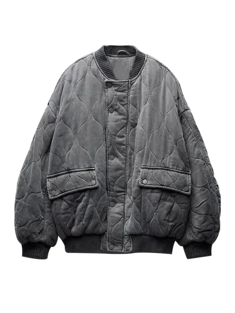 Black quilted bomber jacket relaxed loose fit with button-zipper closure and round neck streetwear style